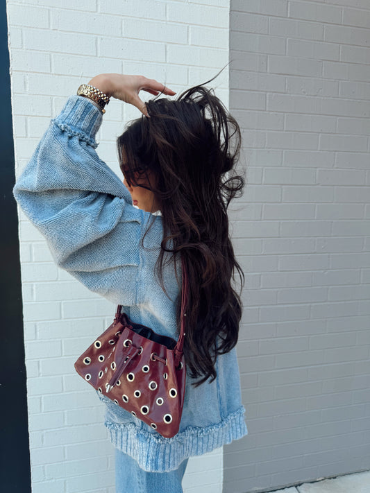METAL EYELET BUCKET BAG